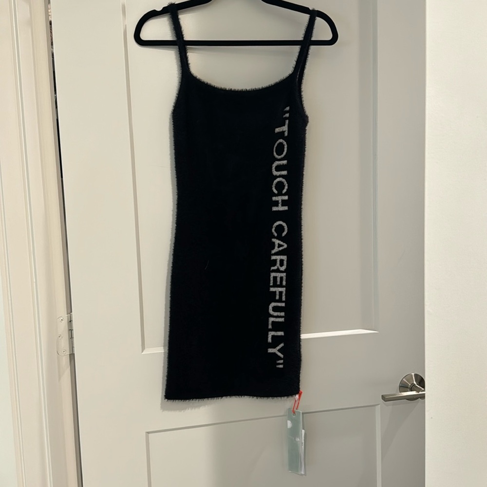 Off white “touch carefully “ fuzzy dress never been worn new with tags